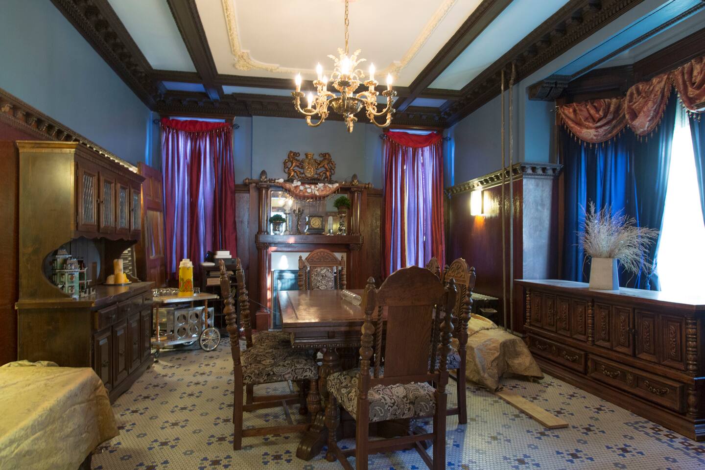Victorian dining room with a long wooden table and chandelier